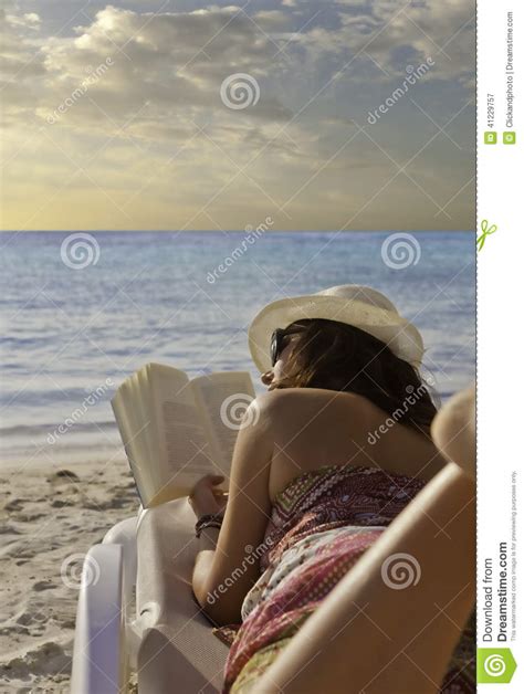 Reading on the beach stock image. Image of holidays, blond - 41229757