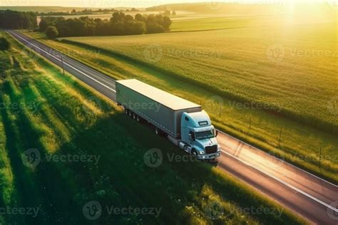 Big Blue Truck Driving Fast With A White Trailer With Blank Space For