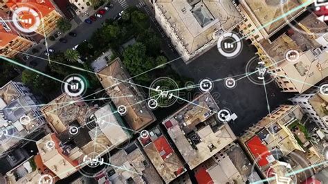 Animation Of Network Of Digital Icons Against Aerial View Of Cityscape