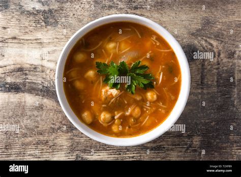 Harira soup in bowl on wooden table Typical Moroccan food Ramadán