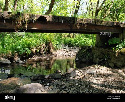 Old Wooden Bridge Over Stream Uk 2013 Stock Photo Alamy