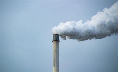 Premium Photo Smoke Emitting From Chimney Against Sky