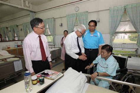 President Tony Tan Keng Yam Interacting With A Patient