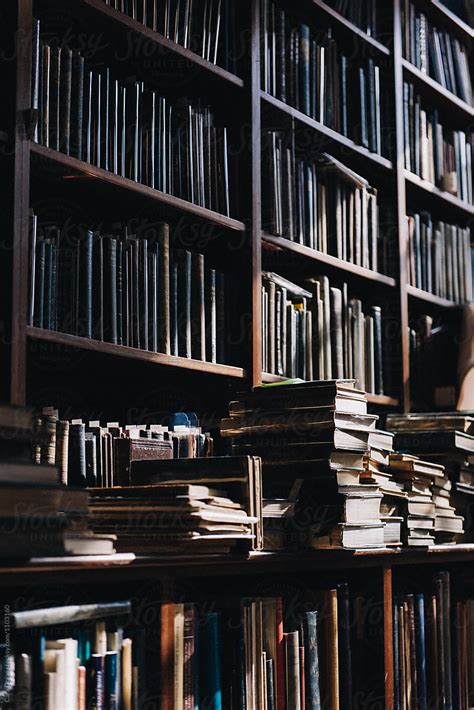 "Collection Of Antique Books On Library Bookshelf" by Stocksy Contributor "Cara Dolan" - Stocksy