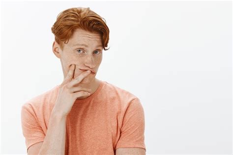 Free Photo Close Up Of Curious Redhead Man Looking Intrigued Making