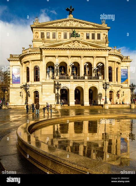 The Alte Oper Frankfurt Am Main Germany With Reflection In Wet Paved