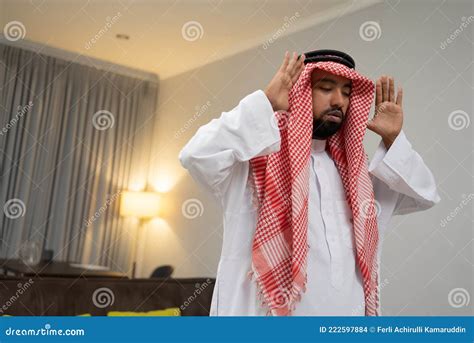 An Arab In A Turban Praying During The Takbir Gesture With Two Hands