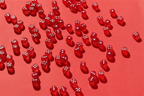 Red Dice Scattered Across Red Background · Free Stock Photo