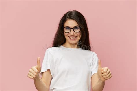 Portrait Of A Beautiful Smart Pleasant Woman In A Light T Shirt And