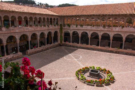 Inner Courtyard With Arches And Columns Decorated With Flowers In