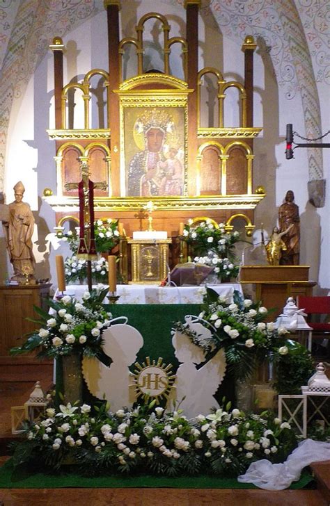 The Altar Is Decorated With Flowers And Candles