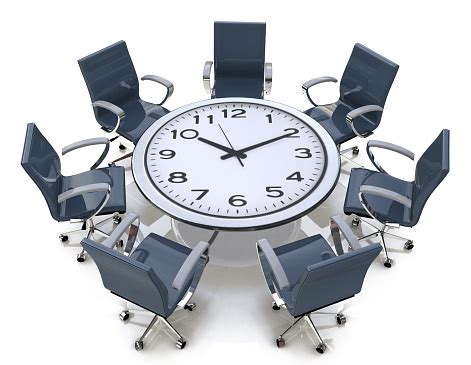 meeting time  table   large clock face stock photo