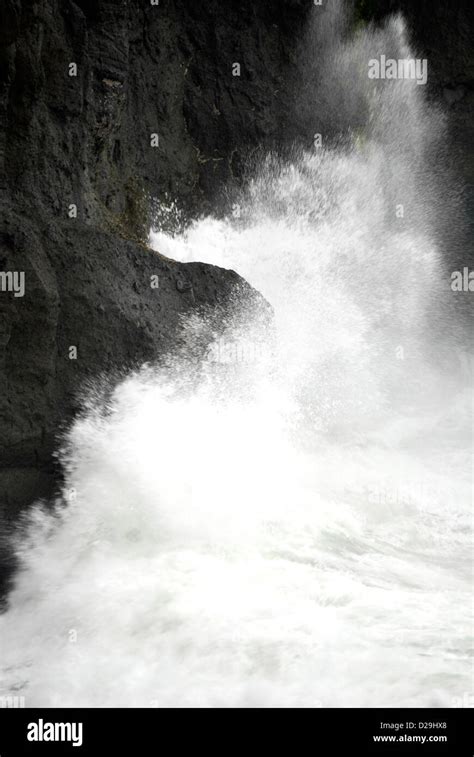 Ocean Wave Crashing On Rocky Coast Stock Photo Alamy