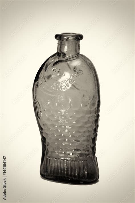 Old colourful bottles against a white background Stock-Foto | Adobe Stock