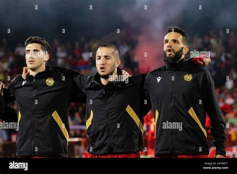 A group of soccer players from the Armenia National team in a stadium ...