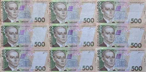 A close-up of a pattern of many Ukrainian currency banknotes with a par ...