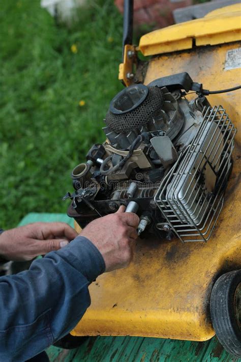 Repairing Lawn Mower Engine Stock Image - Image of mechanic, closeup ...