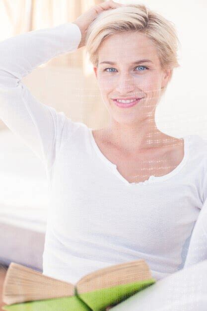 Premium Photo Smiling Blonde Woman Reading A Book