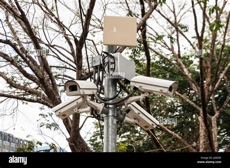 Four Cctv Surveillance Security Cameras Point In Different Directions