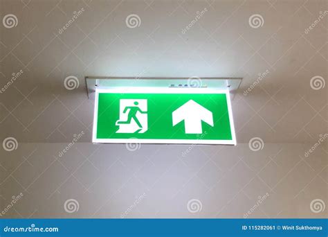 Glowing Emergency Exit Sign With Left Arrow At A Building. Safety First ...