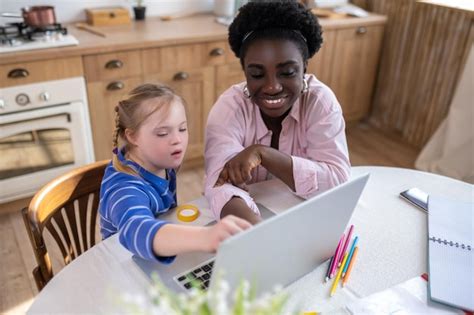 Premium Photo A Girl With Down Syndrome Having A Lesson With Her