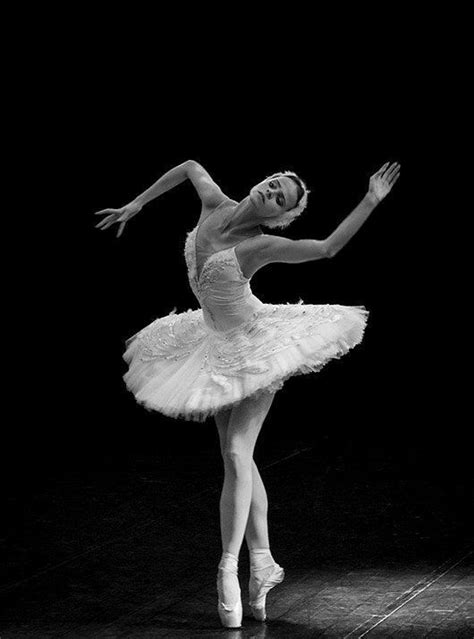 A Ballerina In White Tutu And Ballet Shoes