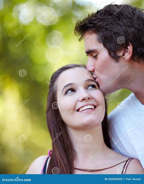 Young Love Shot Of Young Couple Sharing A Tender Moment In The Park