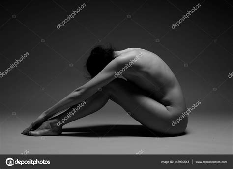 Beautiful Nude Woman Practicing Yoga Stock Photo By Zhagunov 145930513