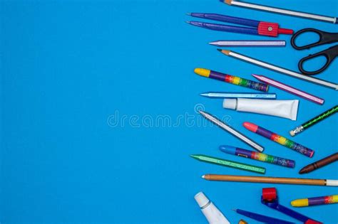 School Supplies On A Blue Background With Copy Space Stock Photo