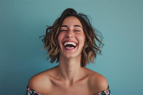 Premium Photo A Woman Laughing With Her Eyes Closed