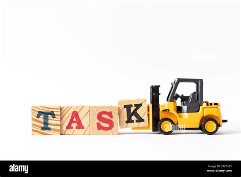 Toy Forklift Hold Wood Letter Block K To Complete Word Task On White