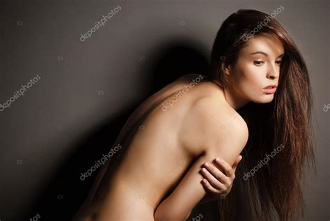 Posing Brunette Woman With Long Hair On Gray Stock Photo Julenochek