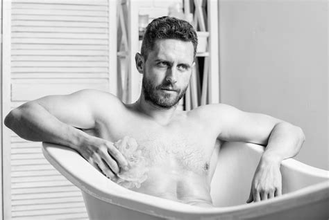 Premium Photo Sex And Relaxation Concept Wash Off Foam With Water Carefully Macho Enjoying