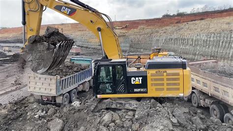 Caterpillar F Excavator Loading Trucks With Four Passes Ascon Ltd