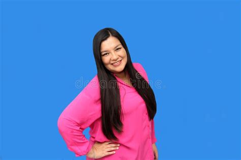 Successful 40 Year Old Latina Woman With Long Straight Brown Hair Smiles And Poses For The