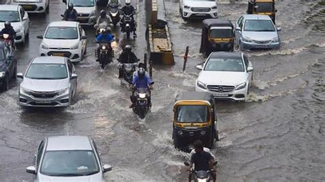 Rain Batters Mumbai Flooded Roads And Rail Tracks Leave Commuters