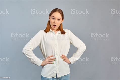 Shocked Amused Girl Standing Stunned Surprised Reacting On Gray