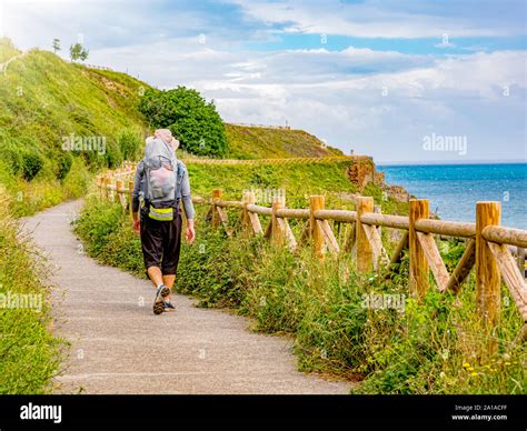 Lonely Pilgrim With Backpack Walking The Camino De Santiago In Spain