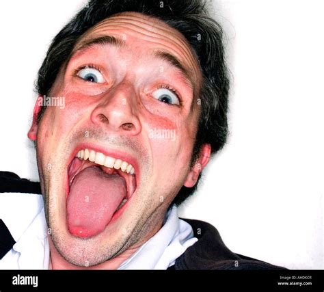 Man sticks his tongue out Stock Photo - Alamy