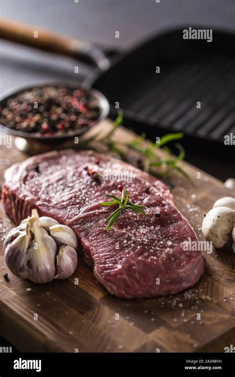 Rib Eye Steak Salt Pepper Spices Garlic And Mushroom Raw Beef Meat On