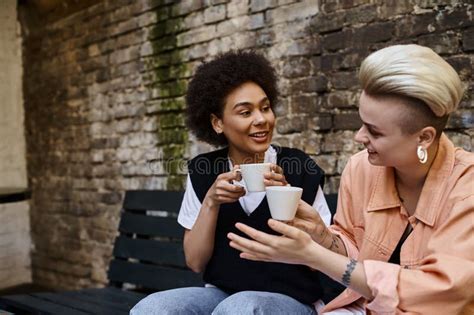 A Diverse Lesbian Couple Embraces Each Stock Photo Image Of Cozy Girlfriend