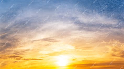 premium photo  bright sun  rising   cloudy morning sky