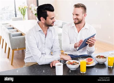 Smiling Gay Couple Having Breakfast Stock Photo Alamy