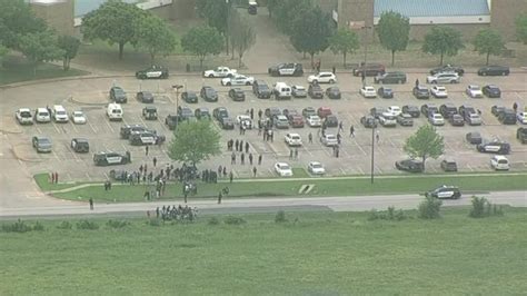 Students walk out of Wilmer-Hutchins High School days after shooting