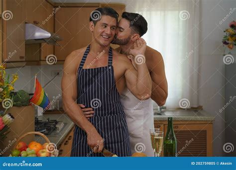 Caucasian Lgbtq Gay Couple Enjoying Cooking Food Together In Kitchen