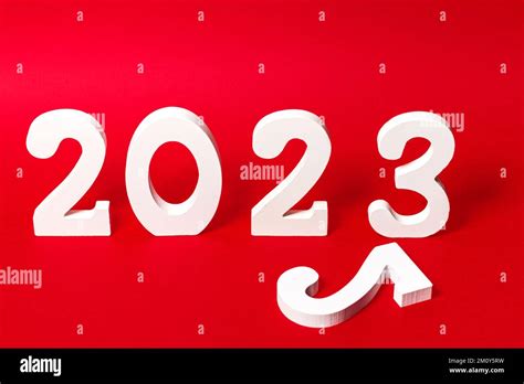 Number 2023 of white wooden figures on red background with a number 2 ...