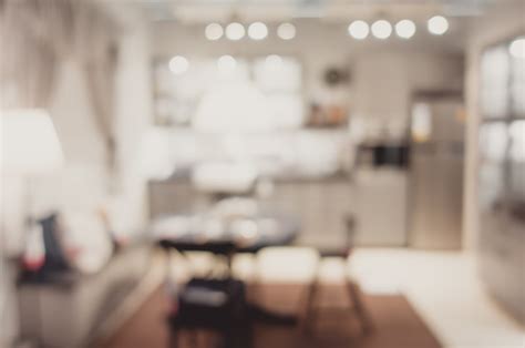 Blurred Background Modern Kitchen And Dinning Room In House With Bokeh