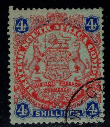 Rhodesia Scott 37 Used 4 Shilling Coat Of Arms Stamp Nicely Centered