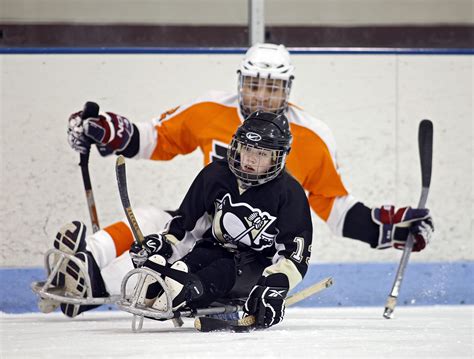 Sledge Hockey - Children learning the game at practice | HockeyGods