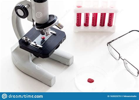 Blood Testing Laboratory Samples Viewing Under Microscope Near Tubes